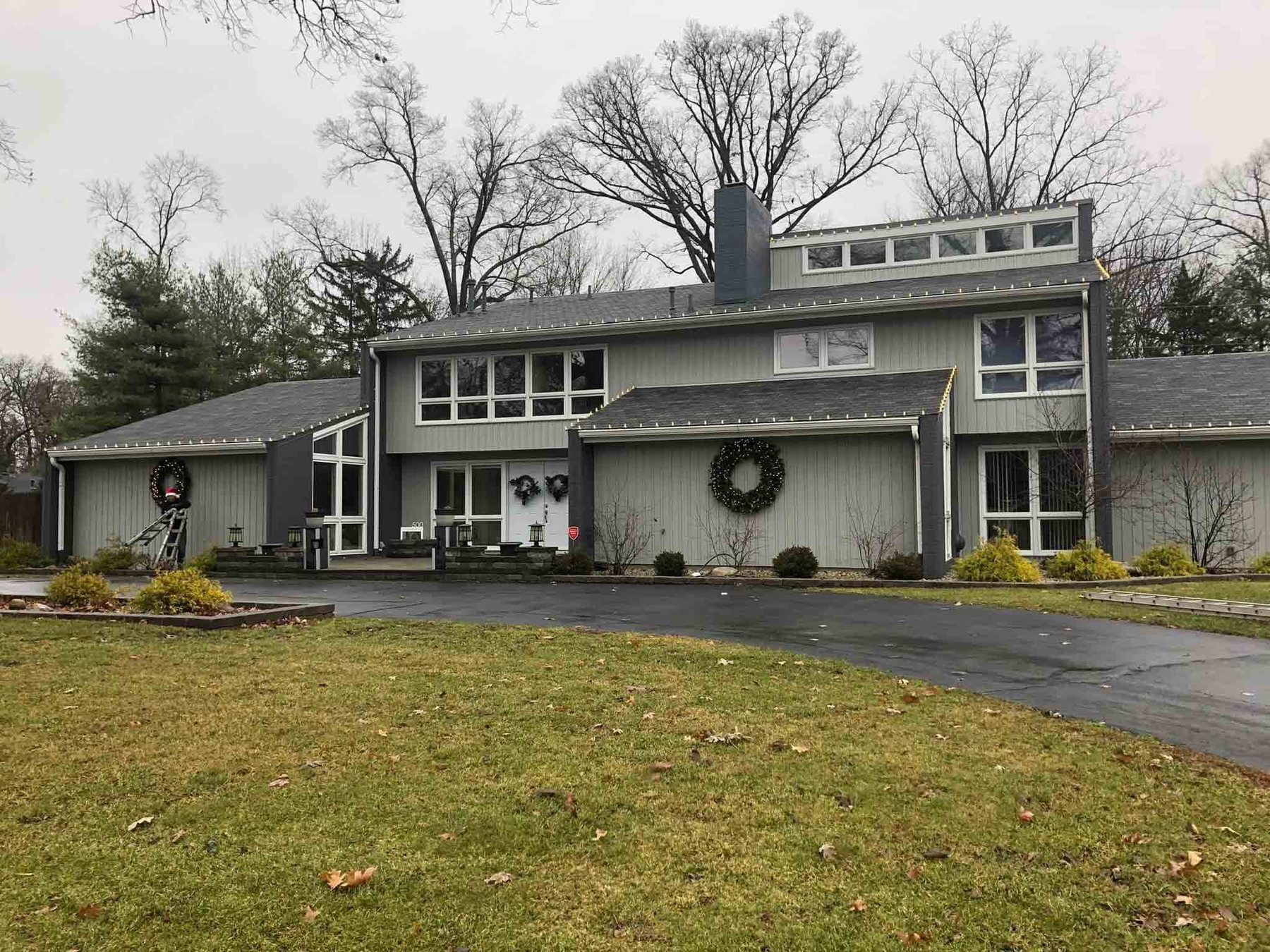 Indiana office building with lighted Christmas wreaths on the front elevation
